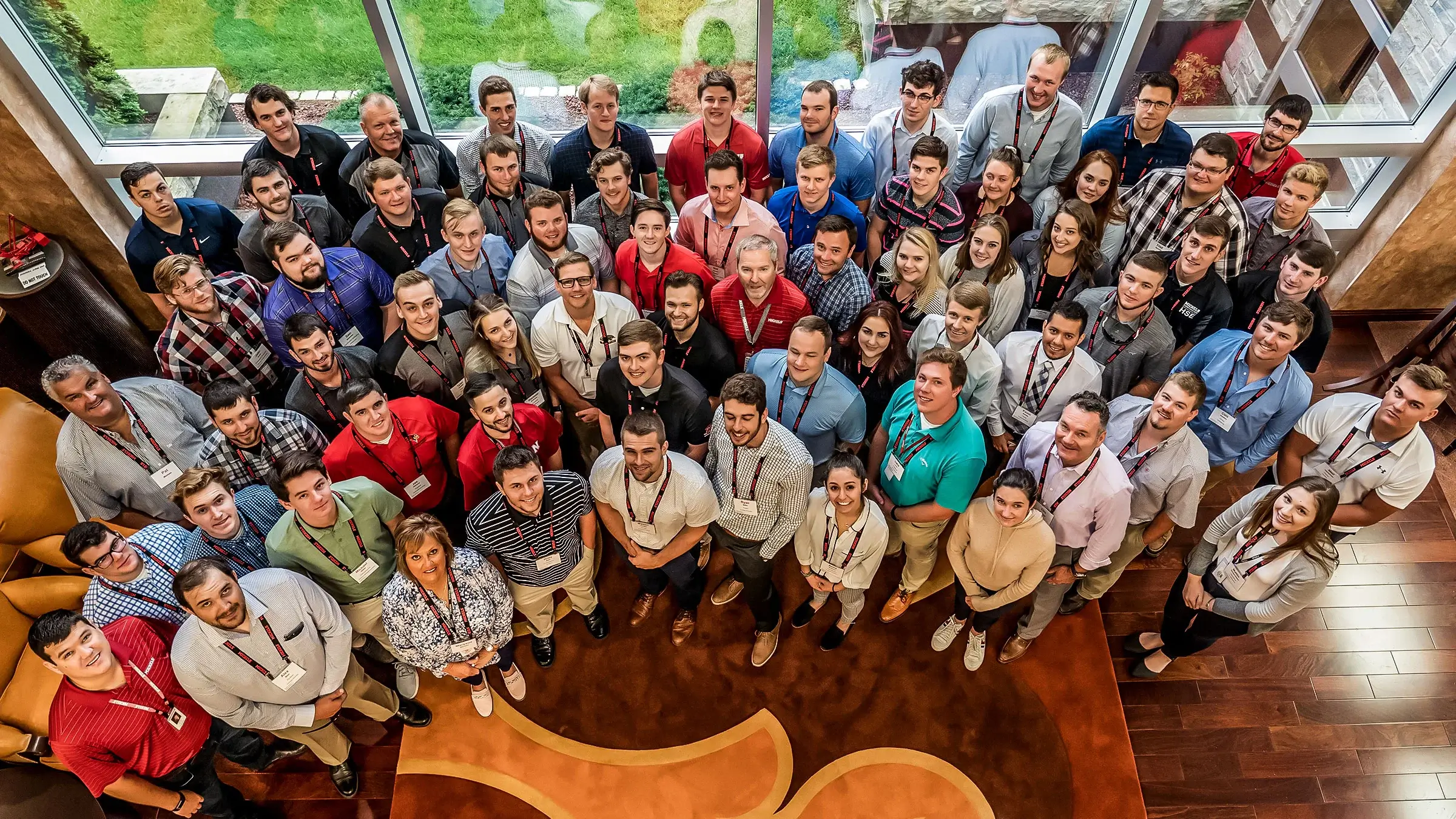 Intern group stands in reception for photo during Intern Summit.